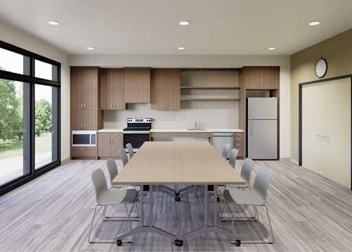 A modern kitchen with a dining table and chairs.