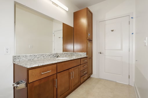 Full bathroom with granite at Avenue Grand Apartments in White Marsh, MD