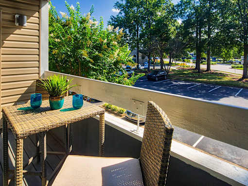Patio with a table and chairs at Compass at City Center, Newport News