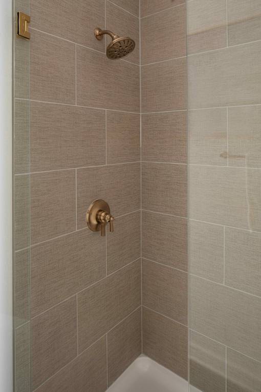 A shower head mounted on a wall.