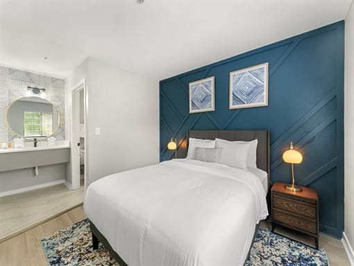 Furnished Bedroom with cozy bed and lamp  at the 505 Collection in Atlanta, Georgia.