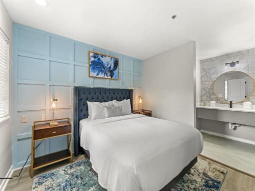 Furnished Bedroom with bed, lights and bed table at the 505 Collection in Atlanta, Georgia.
