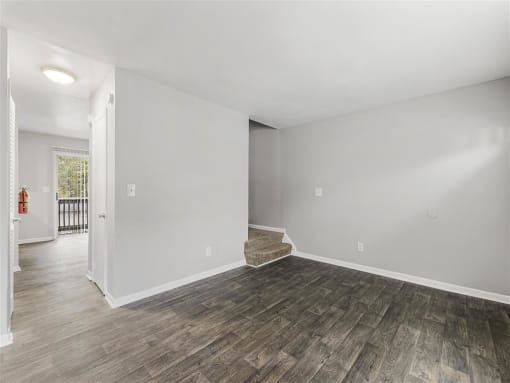 Spacious Living Room New Flooring Throughout  at Pinewood Townhomes, Tucker, GA, 30084