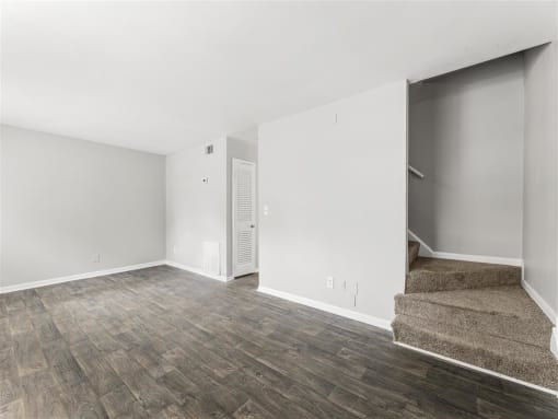 Spacious Living Room New Flooring Throughout  at Pinewood Townhomes, Georgia, 30084