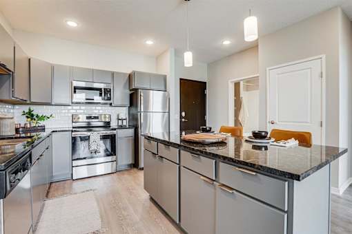 Kitchen Sink With Faucet at Maven Apartments, Burnsville, MN, 55337