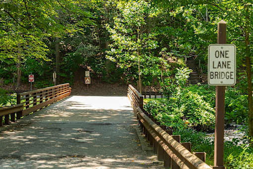 A bridge with a sign that says