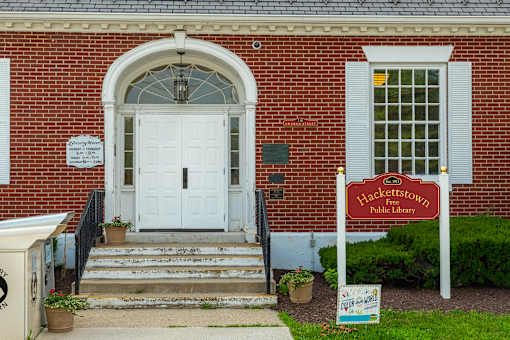 A brick building with a sign that says Hackettstown Public Library.