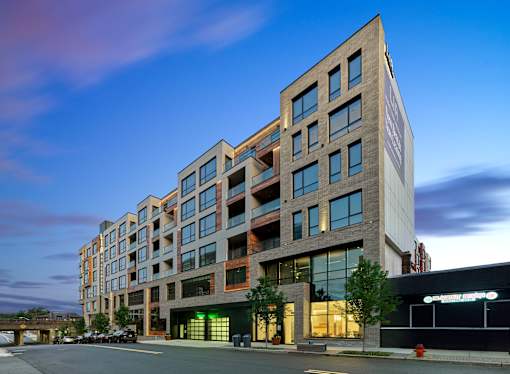 Luxury apartment rental community with expansive amenity package and resort-style pool