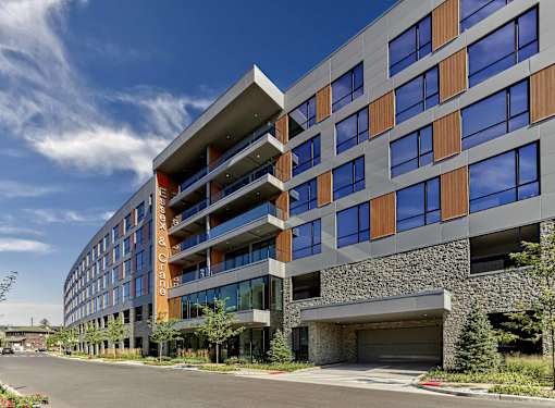 Exterior view of luxury apartments near train station at Essex & Crane, Orange NJ