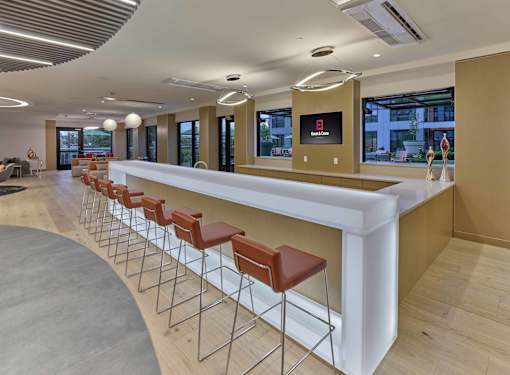 resident clubroom, indoor outdoor amenities, bar area, pool tables, lounge seating