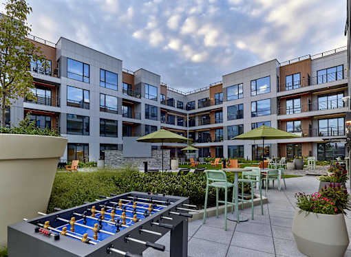 outdoor game tables, seating, outdoor bar, grills