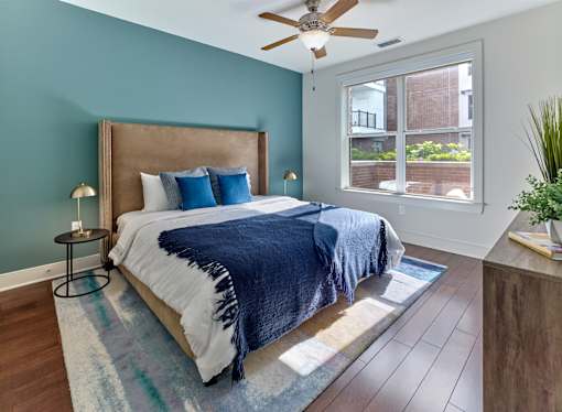 Large bedroom, large windows, ceiling fan