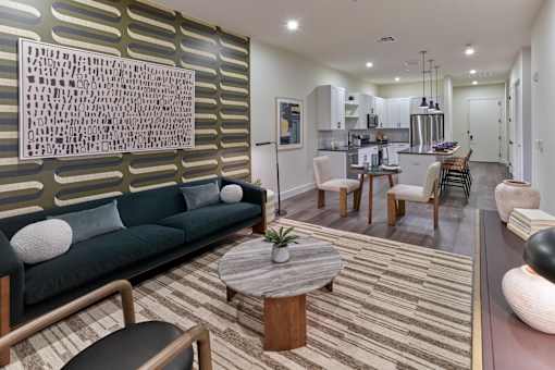 A modern living room with a green sofa and a coffee table.