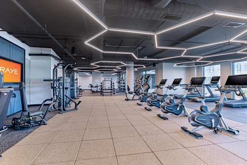A gym with treadmills and exercise equipment.