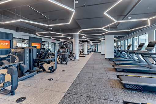 A gym with treadmills and exercise equipment.