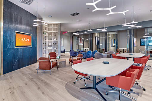 A conference room with a RAY sign on the wall.