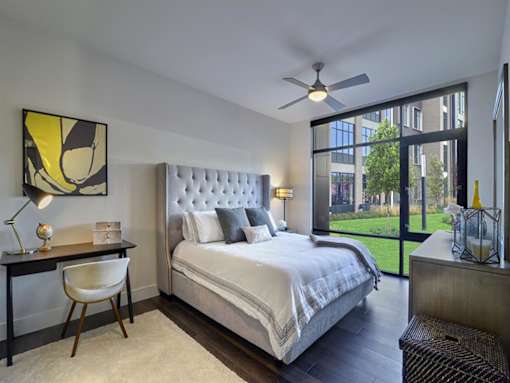 Bedroom with floor-to-ceiling windows at Vermella Union, Union NJ.