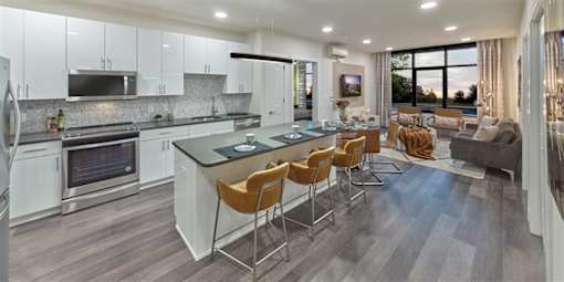 Modern kitchen with large island and oversized windows at Vermella Union, Union NJ