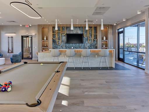 Recreational lounge area with a pool table and communal space at Ora luxury apartments in Hackensack, NJ