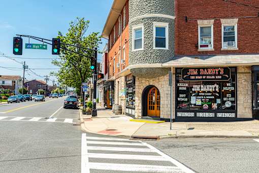 A street view with a restaurant named Jim Dandy's on the corner.