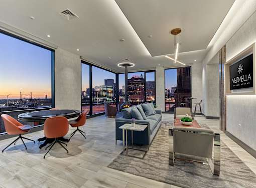 Luxury top-floor lounge with NYC skyline views, resident clubhouse at Vermella Broad Street, Newark NJ.