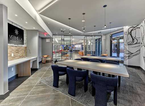 private meeting room, lounge seating, clubroom, resident lounge, media wall, game tables