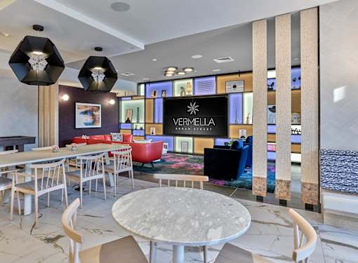 resident lounge, clubroom, amenities, media wall, bar area, table and lounge seating, fireplace, game tables