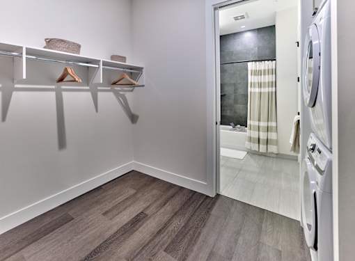 large walk-in closets with built-ins, hardwood flooring throughout, tiled bathrooms