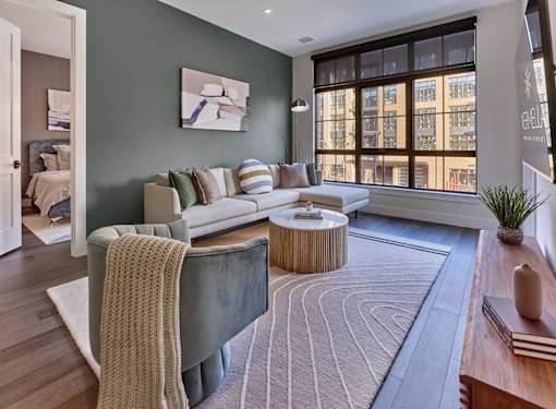 oversized windows, spacious homes, open layout, hardwood flooring, large studio, one, and two bedroom homes, washer dryer in unit