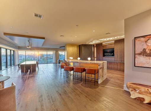 A modern living room with wooden floors and furniture.