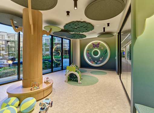 A children's play area with a green and yellow theme.