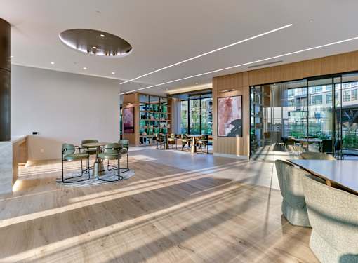 A modern interior with a wooden floor and a large window.