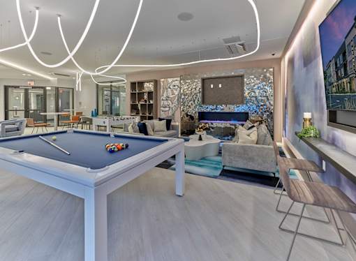 billiards, tv, foosball, game tables, bar area, work space