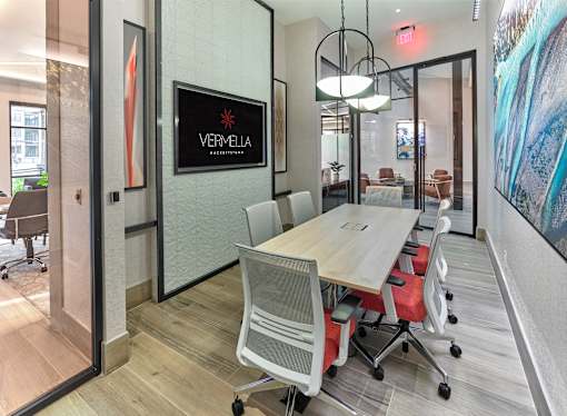 A conference room with a Vermlin sign on the wall.