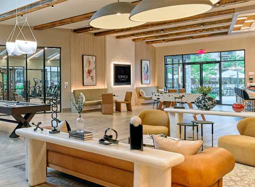 A modern living room with a wooden floor and furniture.