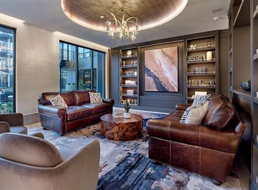 Resident clubroom with library area in luxury rental apartment community.