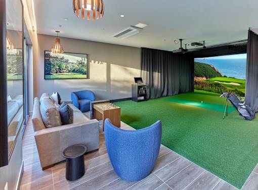 Luxury apartment community with private resident amenity spaces including sport simulator and putting green