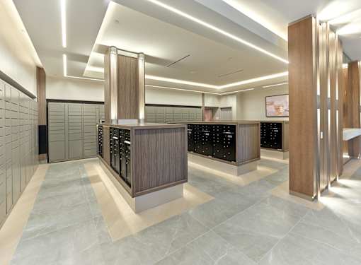A modern kitchen with a tile floor and a black counter.