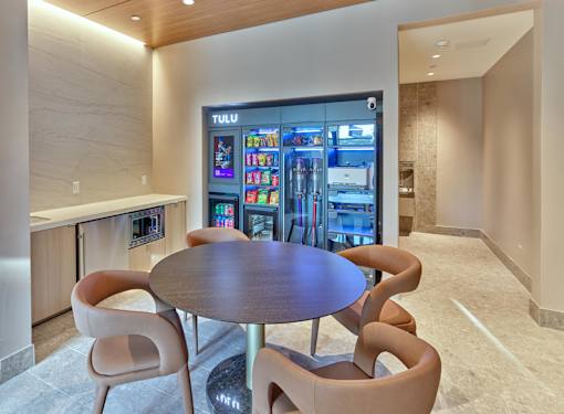 TULU vending machines for easy access to rent vacuums, purchase snacks, and other conveniences in private business center.