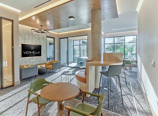 A modern office space with a wooden table and chairs.