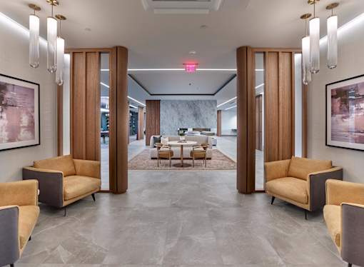 Resident clubroom with game tables, bar area, lounge and table seating