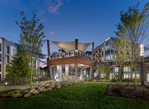 outdoor grills, bar area, seating, splash pad, fireplace, mezzanine and lounge