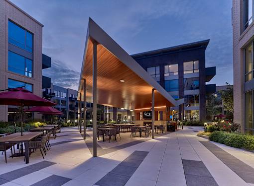 courtyard, outdoor bar with tv and grills, pizza oven, pool table, game area