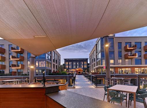 outdoor courtyard, outdoor lounge, bar mezzanine, outdoor tv and bar area