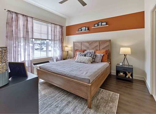 master bedroom, oversize windows, hardwood floors, king bed
