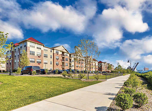 onsite parking, river walk, private balcony, views,