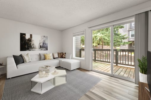 Living room with a white couch and a sliding glass door at Larkspur West Linn, Oregon, 97068