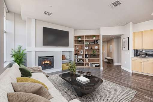 A modern living room with a fireplace and a television. at 1600 Glenarm Place, Denver, Colorado