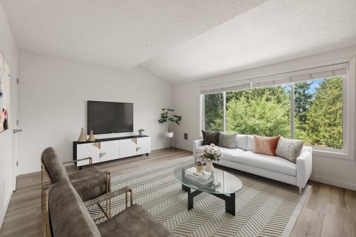 Living room with a couch and a coffee table at Larkspur West Linn, West Linn