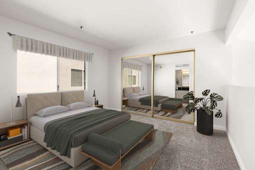 A bedroom with a large bed and a mirror on the wall.